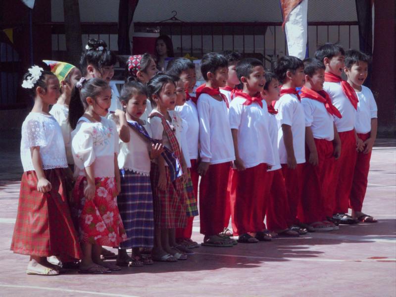 Kids in white and red traditional clothes